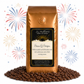 1 lb Stars & Stripes coffee beans bag with coffee beans in front displayed on a white background with fireworks