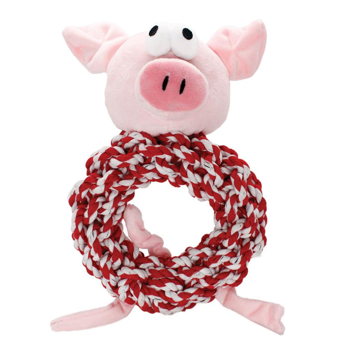 A plush pig dog toy with a spiral tail and a knotted red and white rope toy designed to resemble a candy cane.