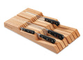 Set of knives with wooden holder on a white background